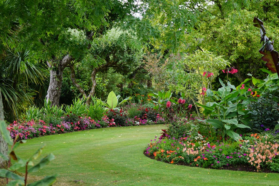 A serene garden pathway surrounded by vibrant flowers and lush greenery, ideal for relaxation.